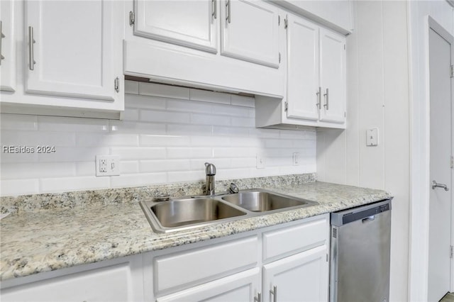 kitchen with white cabinetry, sink, backsplash, and dishwasher