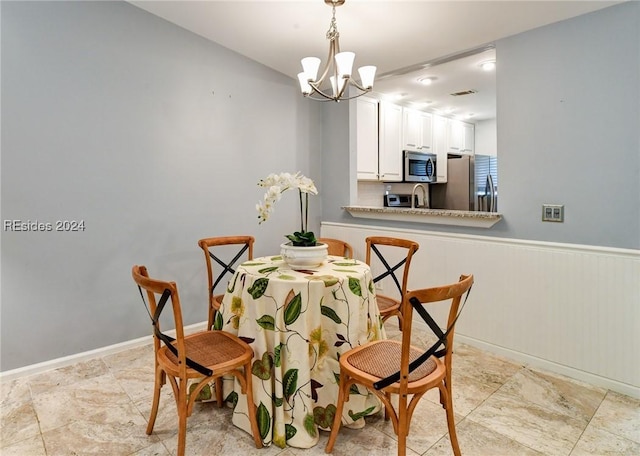 dining room with an inviting chandelier