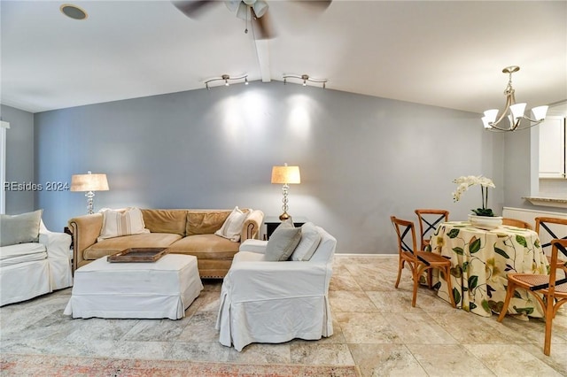 living room with rail lighting and ceiling fan with notable chandelier