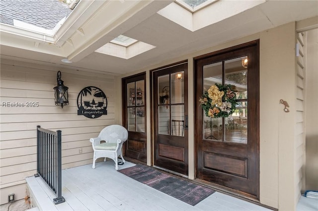 view of exterior entry with covered porch