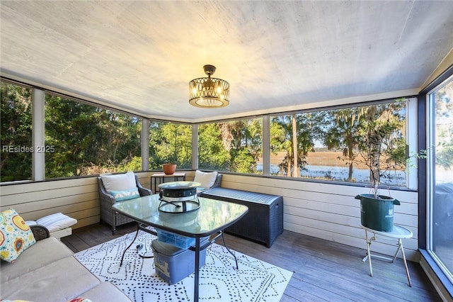 sunroom with a water view