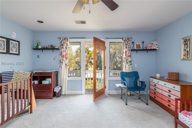 bedroom with ceiling fan and light carpet