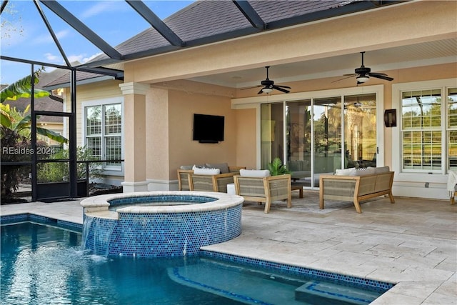 view of pool featuring outdoor lounge area, a patio, ceiling fan, and an in ground hot tub