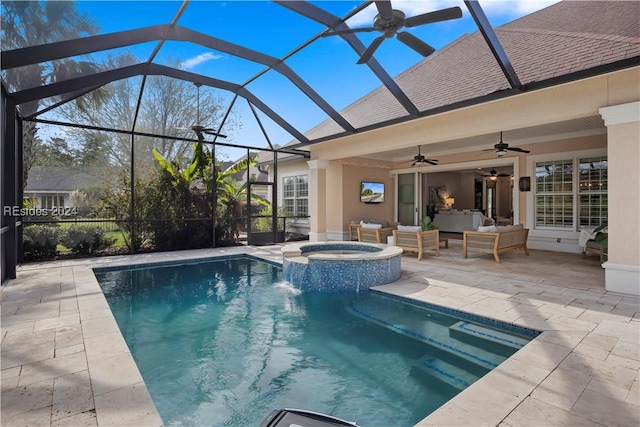 view of pool featuring a patio, outdoor lounge area, an in ground hot tub, ceiling fan, and glass enclosure