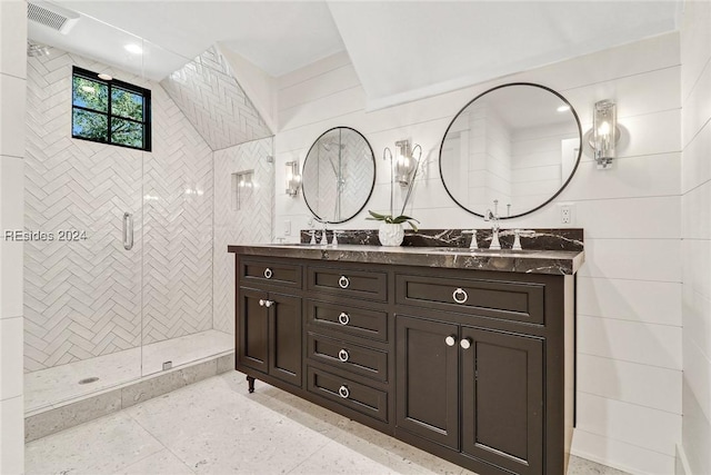 bathroom featuring vanity and tiled shower