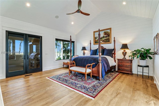 bedroom featuring ceiling fan, vaulted ceiling, light hardwood / wood-style floors, access to outside, and french doors