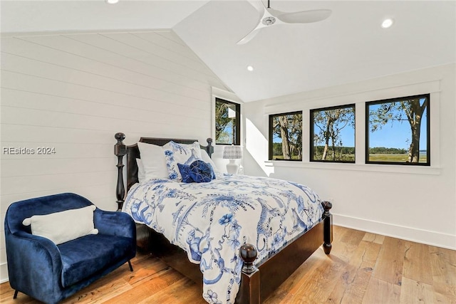 bedroom with lofted ceiling, ceiling fan, and light hardwood / wood-style floors