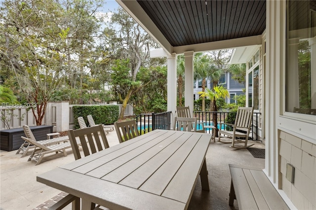 view of patio featuring a pool