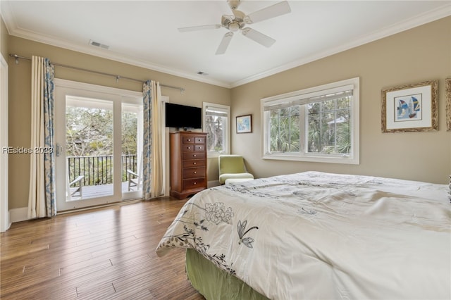 bedroom with ceiling fan, ornamental molding, access to exterior, and wood-type flooring