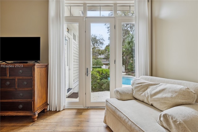 doorway with light hardwood / wood-style flooring