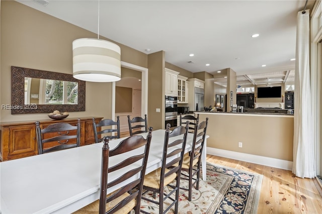 dining space featuring light hardwood / wood-style flooring