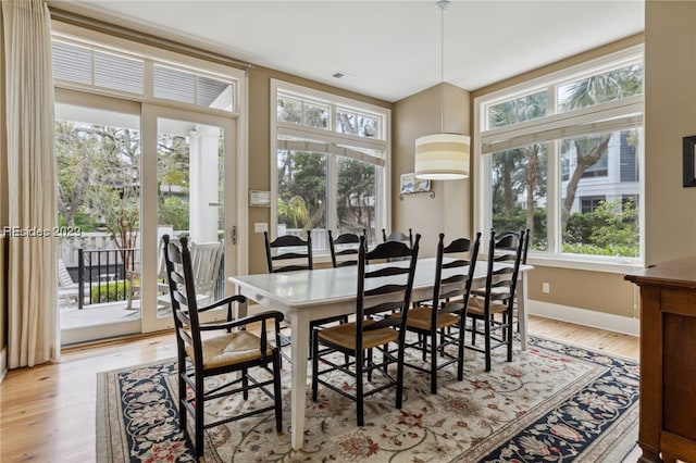 dining area with light wood-type flooring