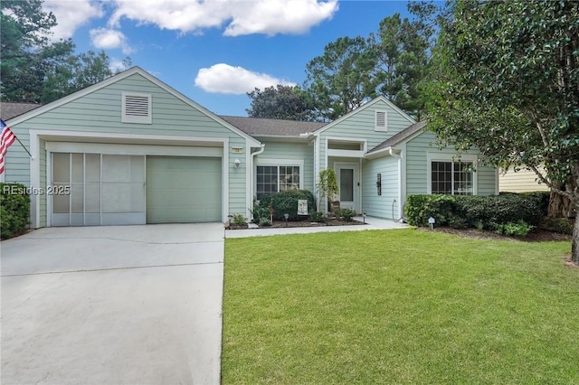 view of front of property with a garage and a front yard