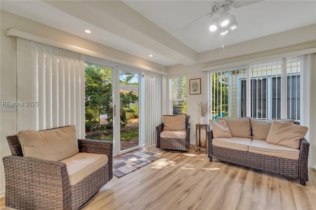 sunroom / solarium with ceiling fan