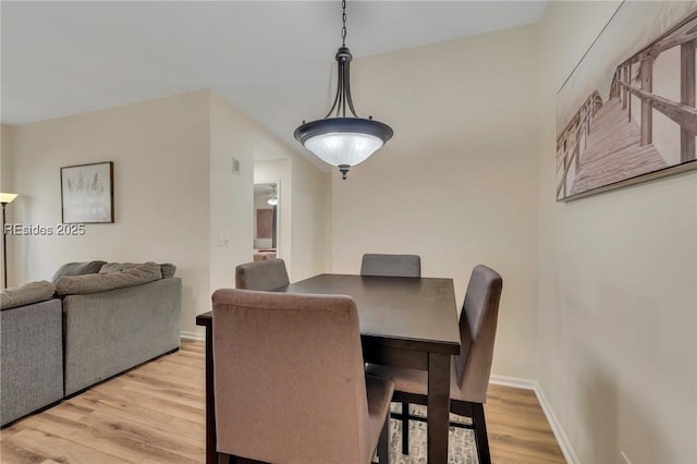 dining area featuring light wood-type flooring