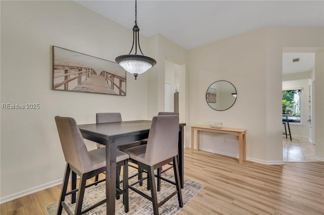 dining space featuring light hardwood / wood-style floors