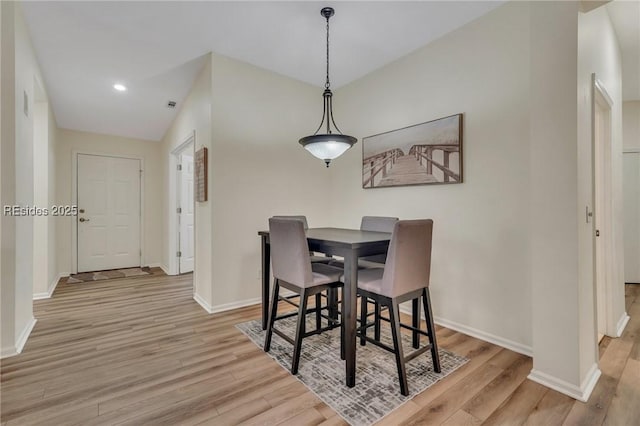 dining area with light hardwood / wood-style flooring