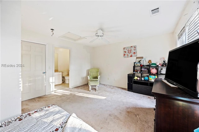 sitting room featuring light carpet and ceiling fan