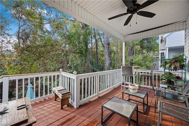 wooden terrace featuring ceiling fan