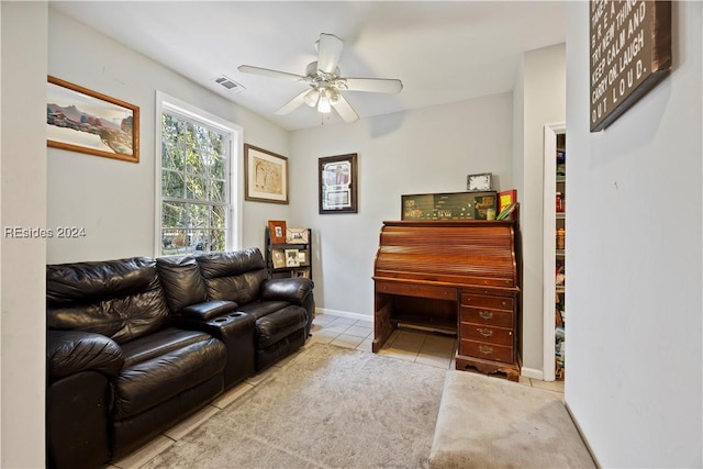 tiled living room featuring ceiling fan