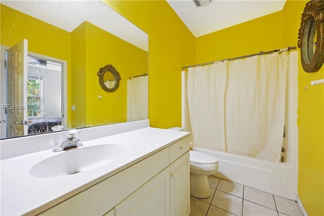 full bathroom with tile patterned floors, toilet, lofted ceiling, vanity, and shower / bathtub combination with curtain