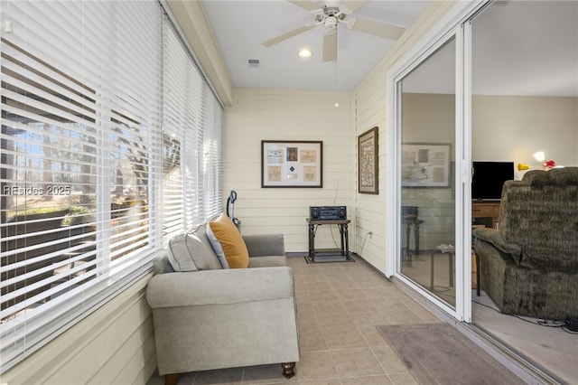 sunroom / solarium with ceiling fan