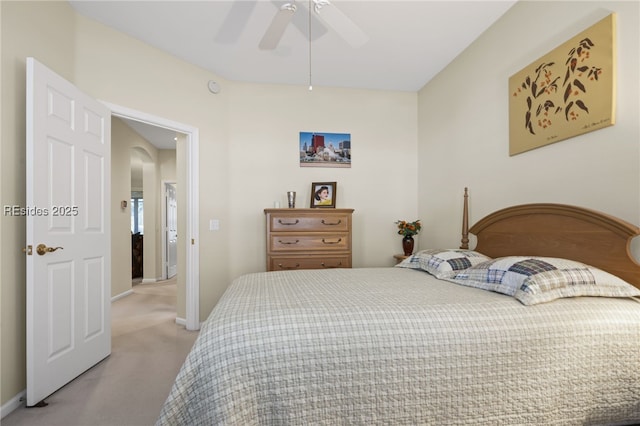 bedroom with ceiling fan and light carpet