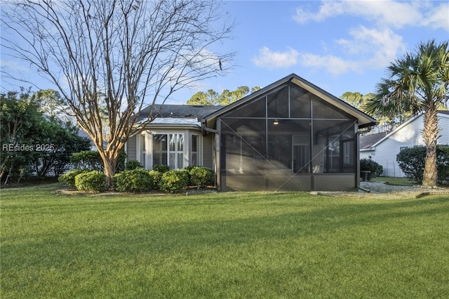 back of house featuring a lawn