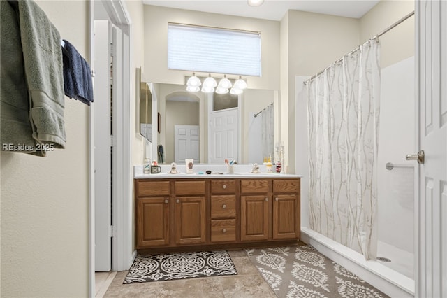 bathroom featuring vanity and walk in shower