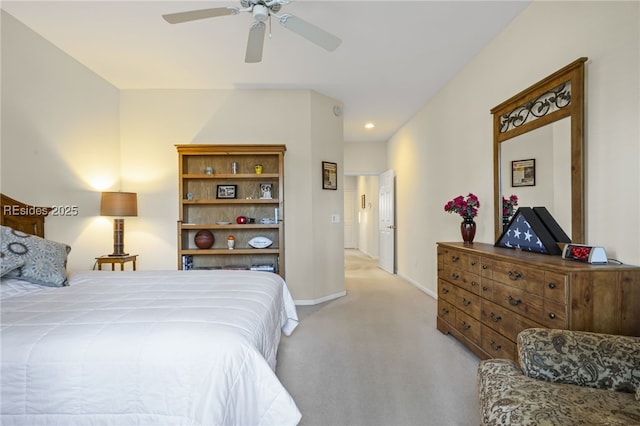 bedroom with ceiling fan and light carpet