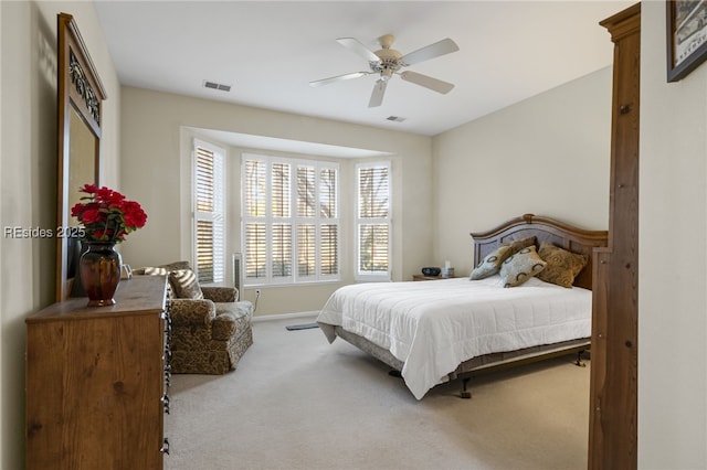 bedroom with light carpet and ceiling fan