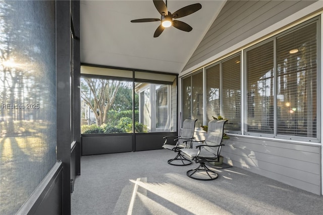 sunroom with lofted ceiling and ceiling fan