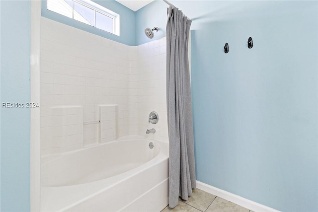 bathroom featuring shower / bathtub combination with curtain and tile patterned floors