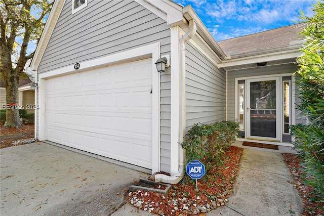 doorway to property featuring a garage