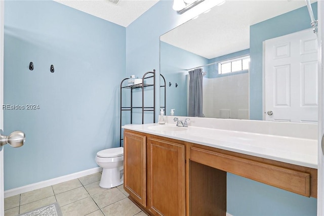 bathroom featuring tile patterned floors, toilet, a shower with shower curtain, and vanity