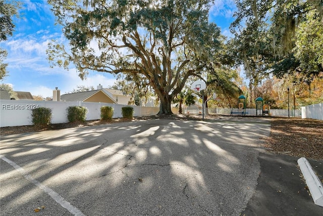 view of home's exterior featuring basketball court