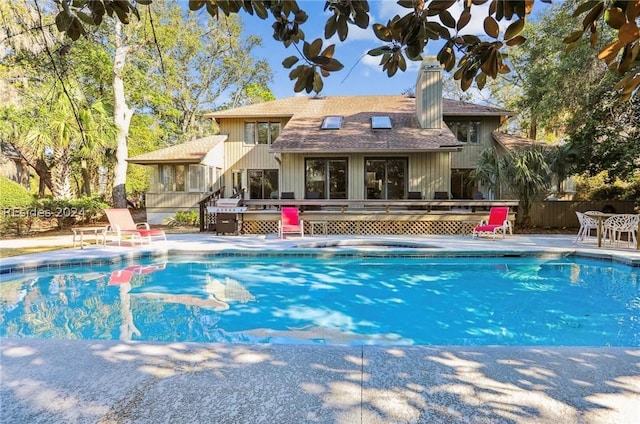 view of pool with a wooden deck