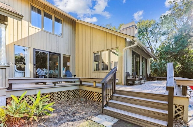 rear view of house with a wooden deck