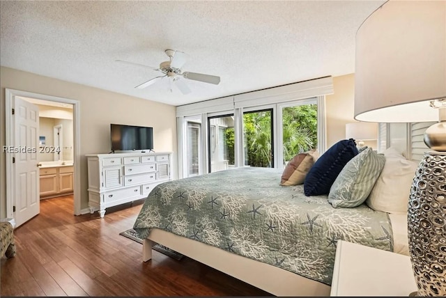 bedroom with connected bathroom, a textured ceiling, dark wood-type flooring, and ceiling fan