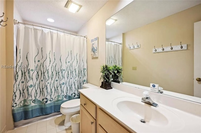 full bathroom with shower / tub combo with curtain, tile patterned flooring, vanity, toilet, and a textured ceiling