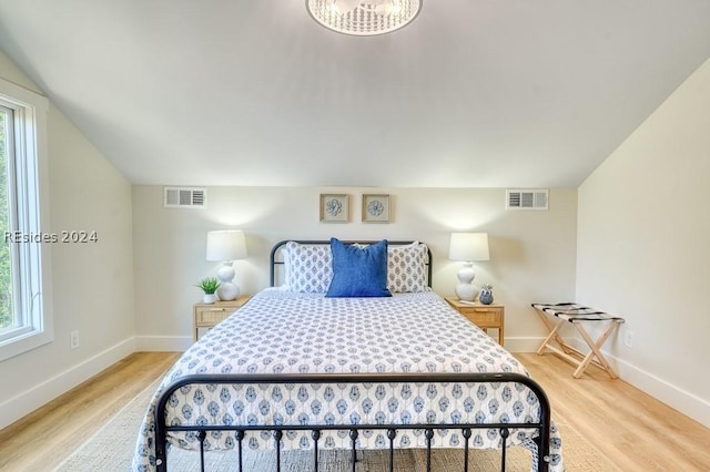 bedroom with hardwood / wood-style floors