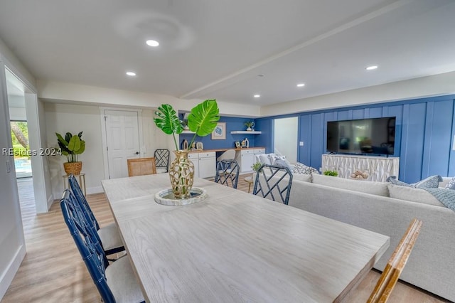 dining space with light hardwood / wood-style flooring