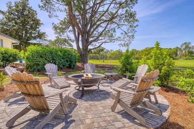 view of patio featuring a fire pit