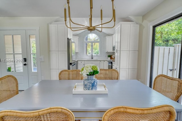 dining space with sink and a wealth of natural light