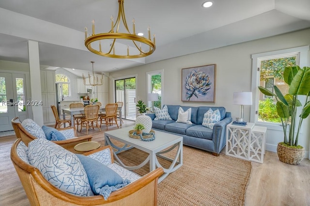 living room with french doors and light wood-type flooring