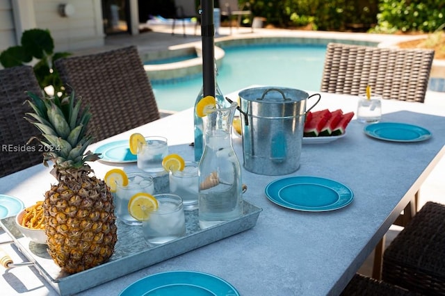 view of pool with a patio area and a hot tub