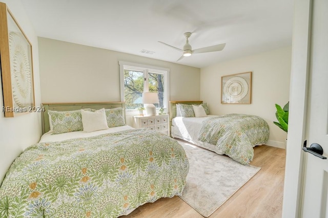 bedroom featuring ceiling fan and wood-type flooring