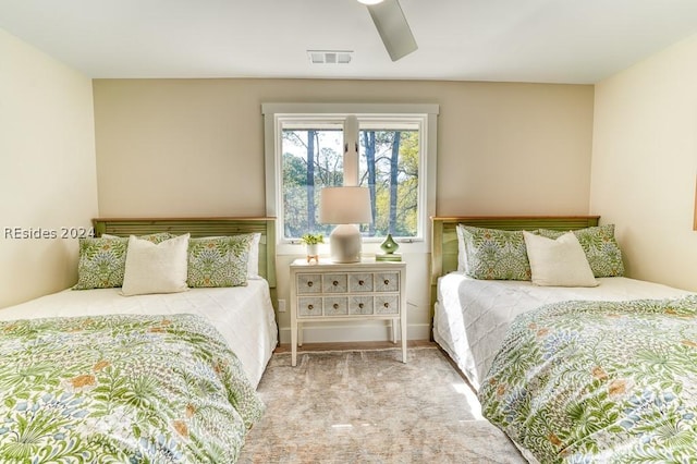 carpeted bedroom with ceiling fan