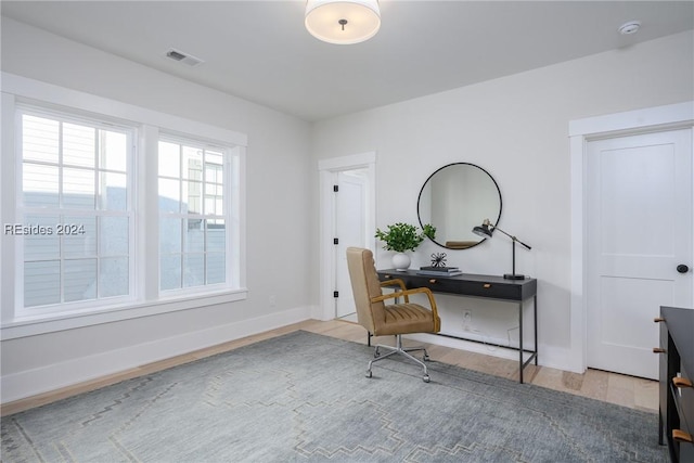 office space with wood-type flooring