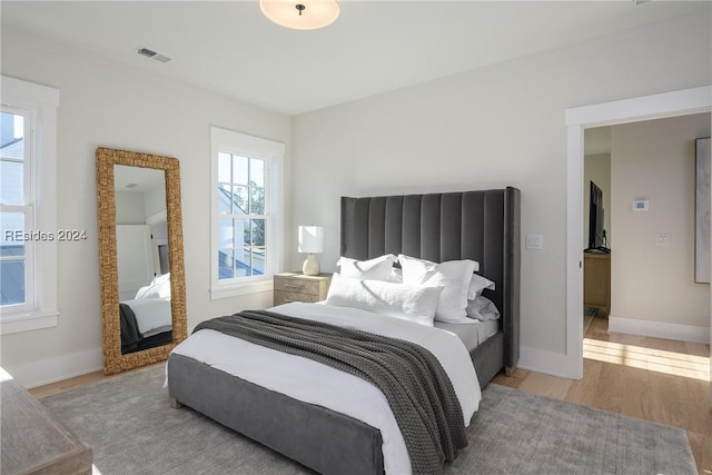 bedroom with light wood-type flooring